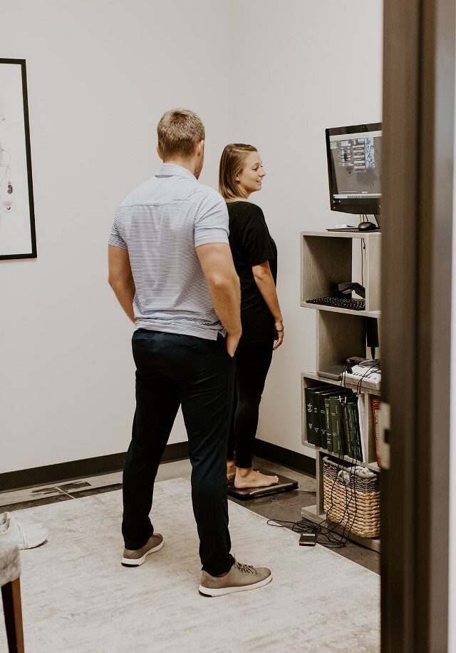 Ryne Malone weighing in a achieve wellness patient